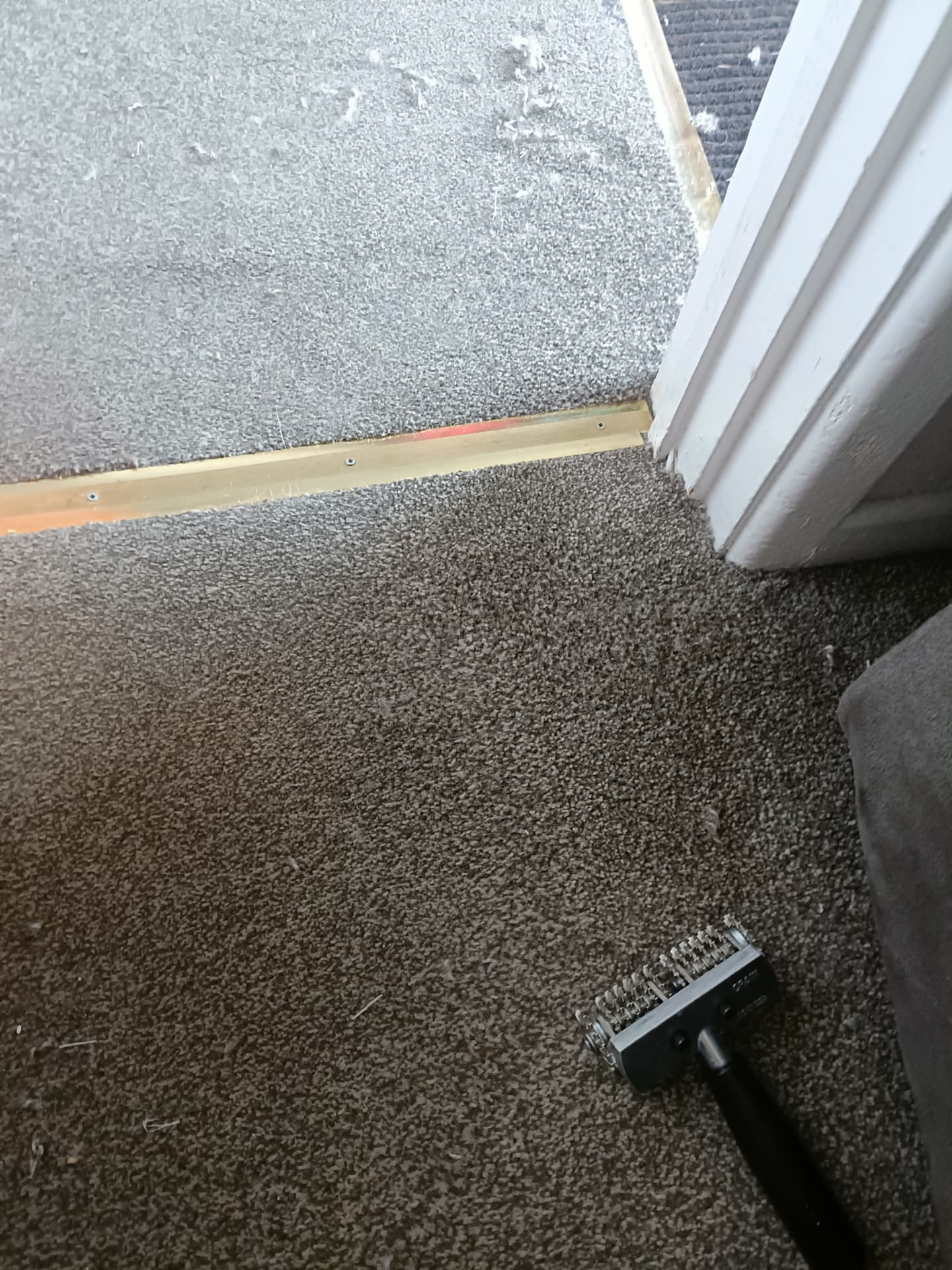 Carpet repair by a doorway threshold in Staffordshire, after professional cleaning