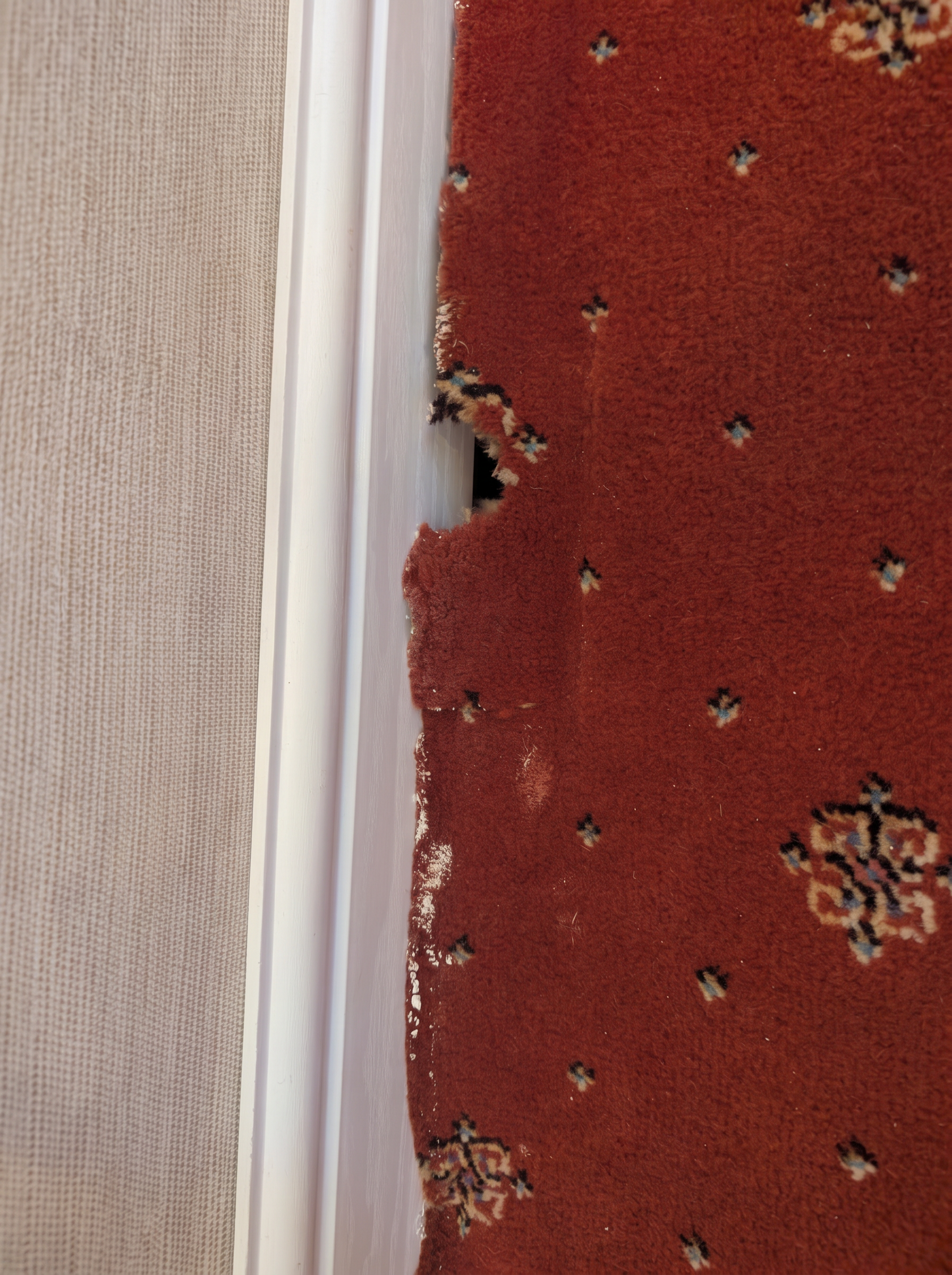 Carpet repair by a doorway in Staffordshire, before professional cleaning